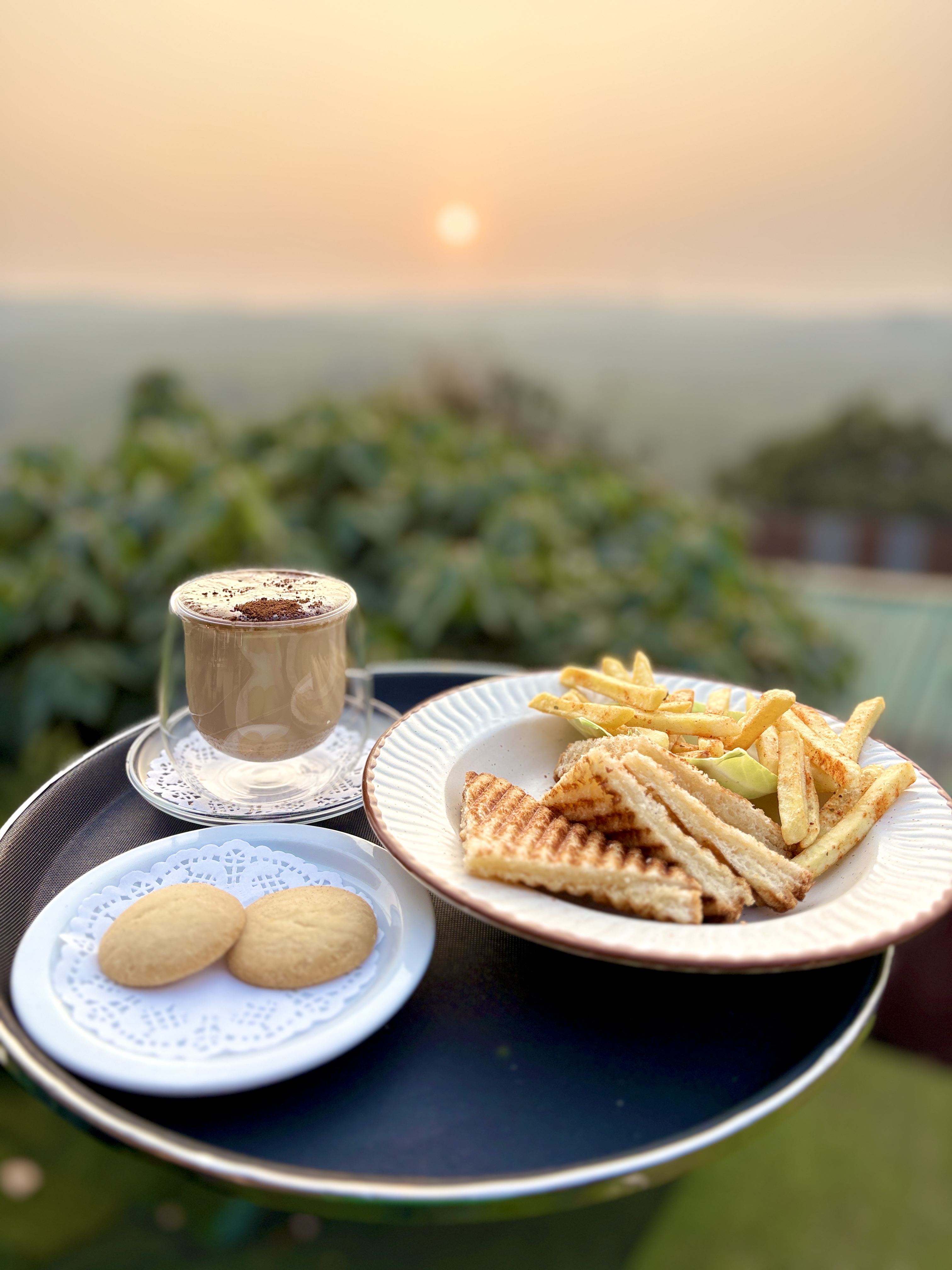 Coffee and sandwich at sunset